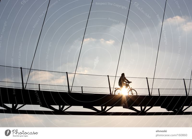 Cycling on sunshine Back-light Trip Sun Bicycle Sky Bridge Driving Hope Suspension bridge Bochum Celestial bodies and the universe Laser ore swing arm Westpark