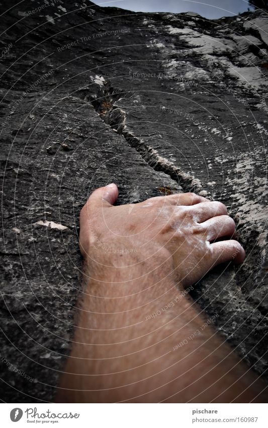 Looking for a stop... Mountain Sports Climbing Mountaineering Hand Fingers Rock To hold on Gray Wall (building) Crack & Rip & Tear Hold Wall of rock