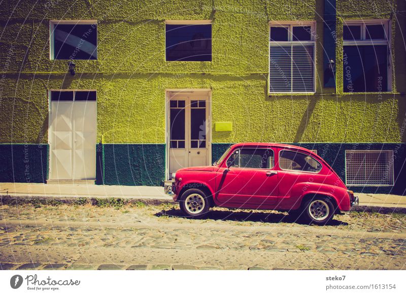 Complementary colour car park Facade Street Car Uniqueness Green Red Flashy Multicoloured Small car Colour photo Exterior shot Copy Space bottom