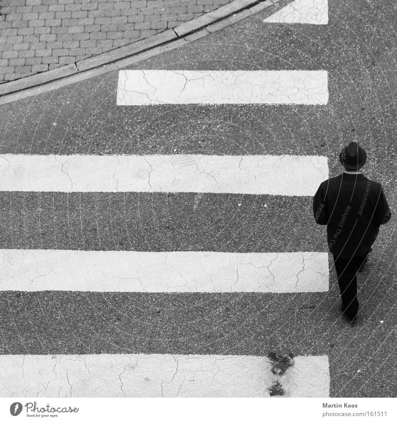 downright Closing time Human being Masculine Man Adults Pedestrian Street Crossroads Road sign Suit Hat Sign Signs and labeling Stripe Old Going Walking Looking