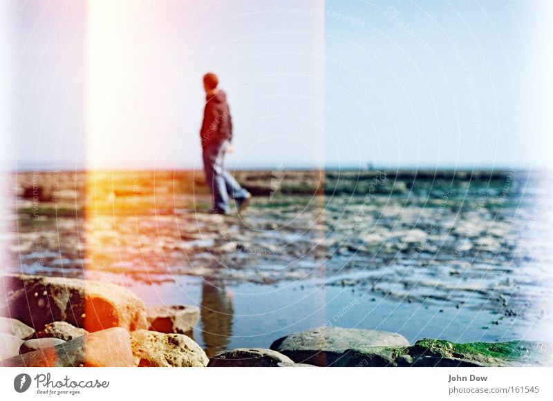 walking on stone Vacation & Travel Far-off places Beach Ocean Human being Man Adults Water Horizon Coast Stone Going Looking Thin Think Uniqueness Mysterious