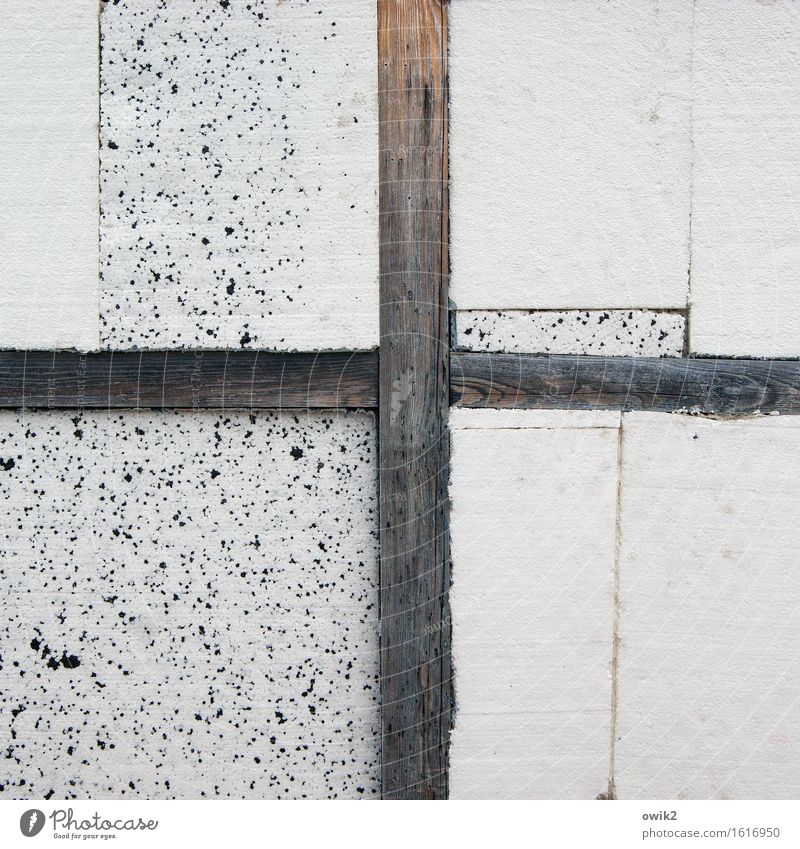 entablature Wall (barrier) Wall (building) Joist Wood Sign Styrofoam Crossed Crucifix Sharp-edged Simple Gloomy Colour photo Subdued colour Exterior shot Detail