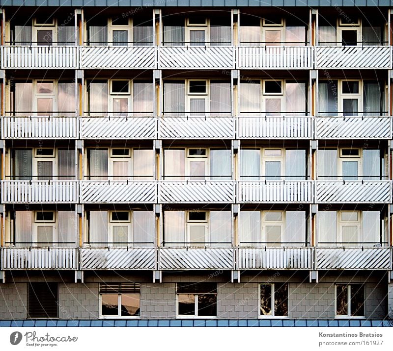 living in a case Colour photo Exterior shot Pattern Front view Cure Manmade structures Building Balcony Window Door Glass Town Protection Society Life