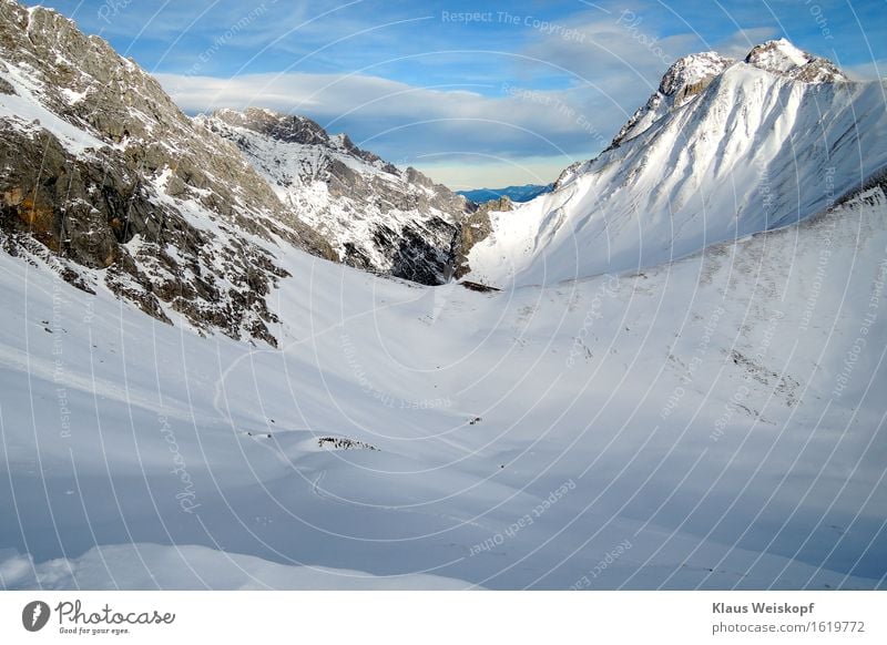 Trace in the ice Landscape Winter Ice Frost Snow Rock Alps Mountain Discover Cold Blue White Willpower Loneliness Colour photo Exterior shot Copy Space right