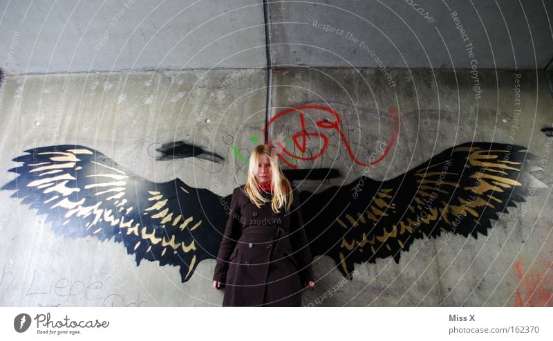 angels Colour photo Exterior shot Young woman Youth (Young adults) 18 - 30 years Adults Tunnel Wall (barrier) Wall (building) Underground Blonde Wing Graffiti