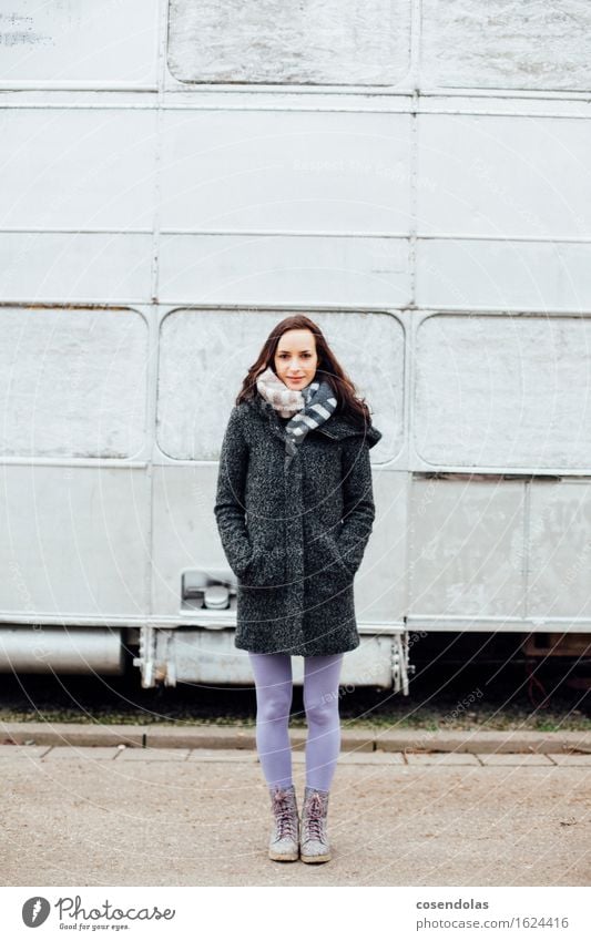 Young woman stands in front of a silver bus University & College student Feminine Youth (Young adults) 1 Human being 18 - 30 years Adults Jacket Coat Boots