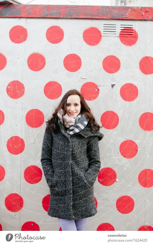 Woman in front of wall University & College student Feminine Young woman Youth (Young adults) Adults 1 Human being Smiling Laughter Stand Contentment