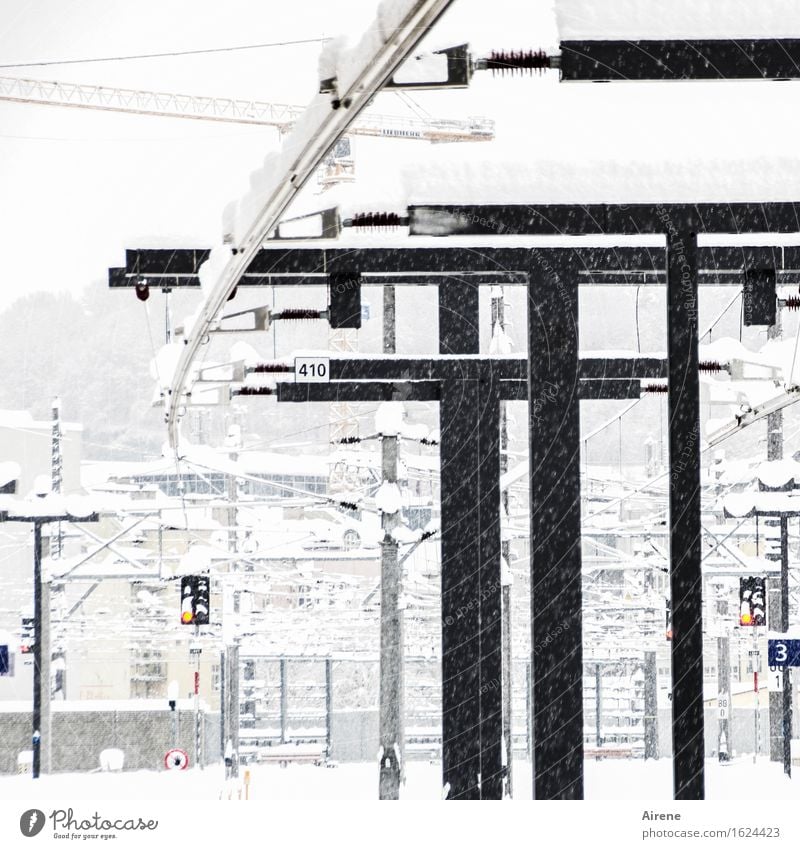 b/w | Winter white making Bad weather Snow Snowfall Train travel Train station Platform Sign Signage Warning sign Road sign Freeze Bright Cold Town Black White