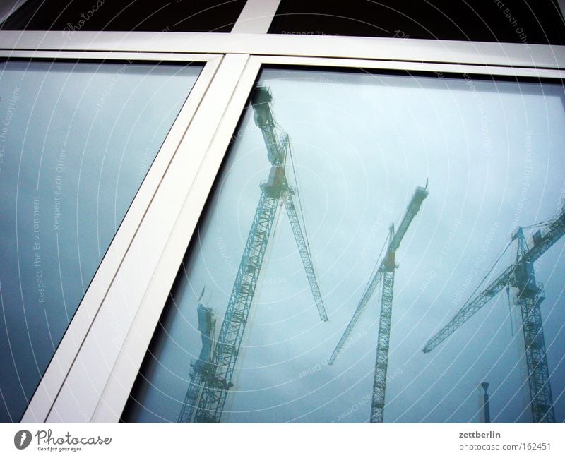 Building on, building on Crane Construction site Industrial Photography Industry Reflection Window Window pane Slice Glass Architecture Sky