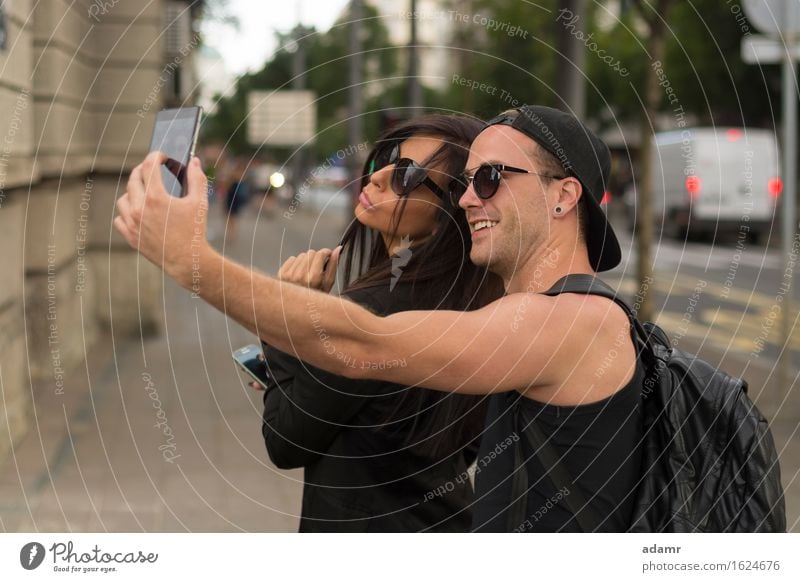 Young couple taking selfies friendship women group people internet street fun photo happiness cheerful smiling lifestyle usrban spring summer joy smart phone