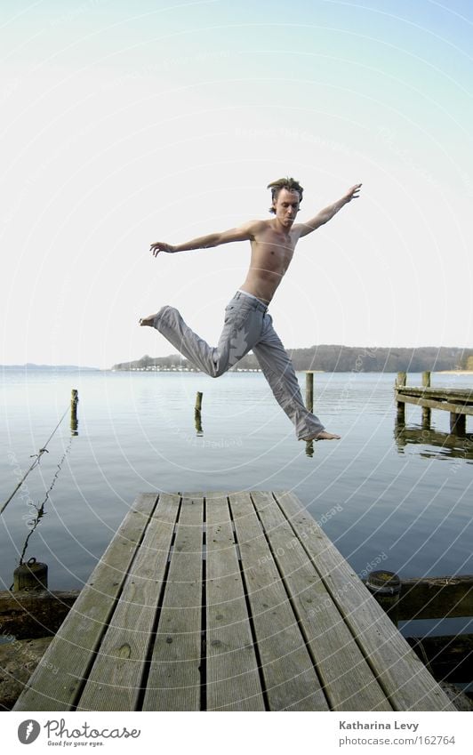 spring! Man Jump Water Lake Footbridge Blue sky Summer Funsport Joy Exterior shot