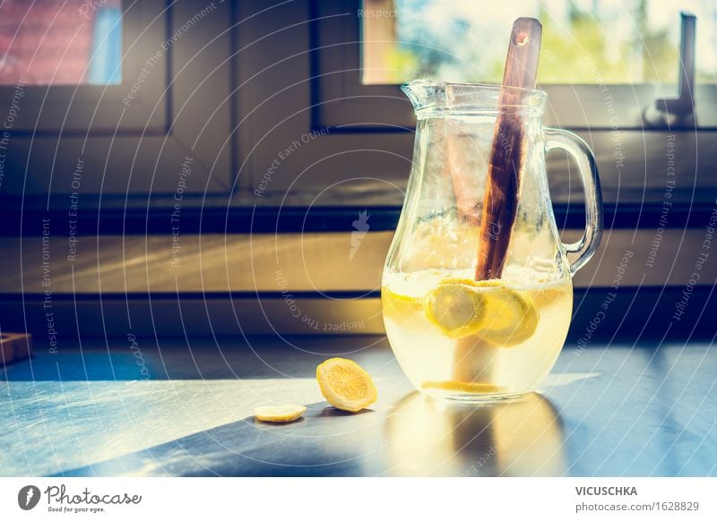 Jug with lemonade on the kitchen table Food Fruit Organic produce Beverage Cold drink Lemonade Juice Longdrink Cocktail Lifestyle Style Healthy Eating