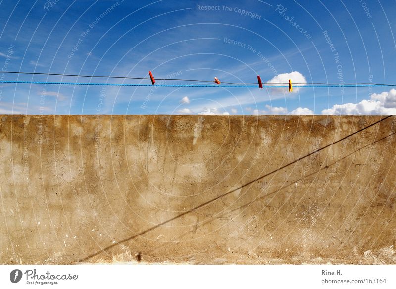 No washing on the line Colour photo Exterior shot Abstract Pattern Deserted Shadow Contrast Sunlight Wide angle Summer Sky Clouds Wall (barrier) Wall (building)