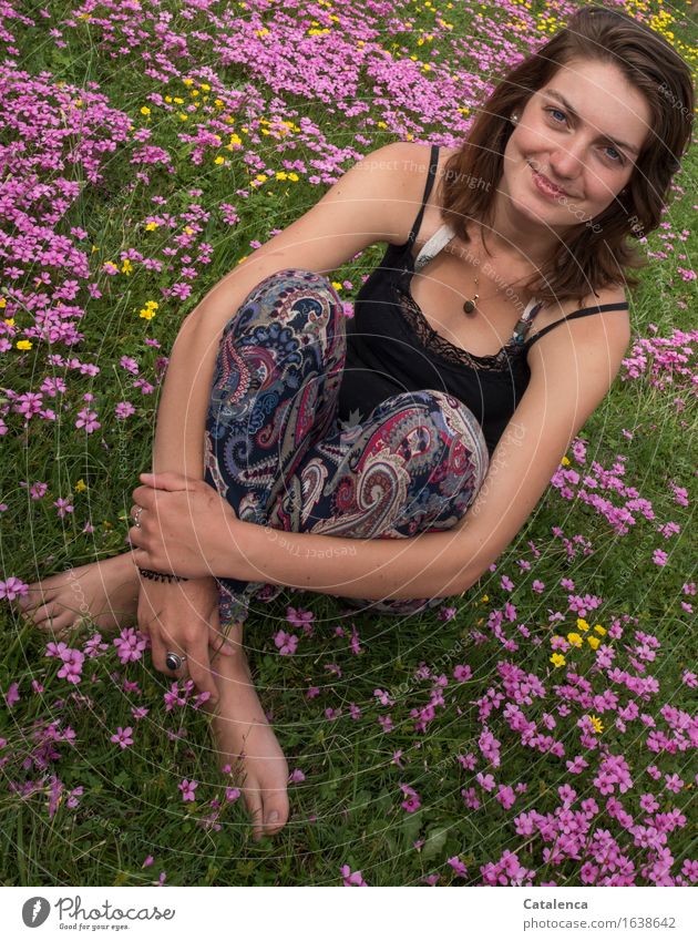 Amid pink and yellow flowers sits a smiling young Feminine Young woman Youth (Young adults) 1 Human being 18 - 30 years Adults Nature Plant Autumn