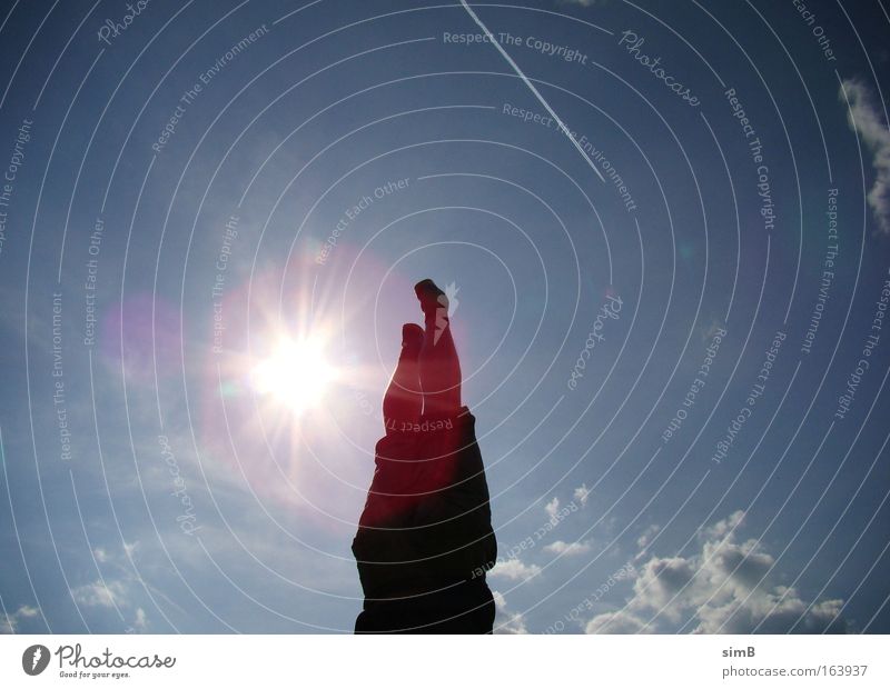 handstand Colour photo Exterior shot Day Silhouette Sunlight Sunbeam Back-light Worm's-eye view Upward Joy Summer Fitness Handstand Airplane Clouds Blue sky