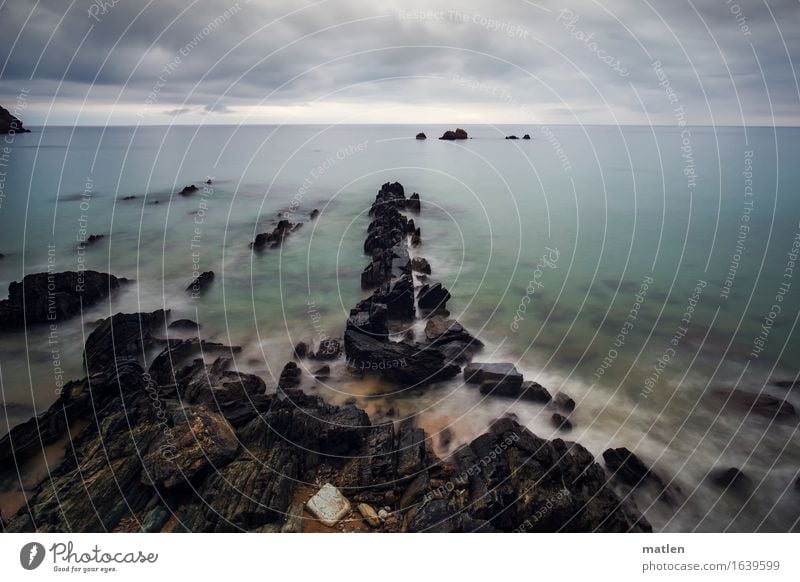 shore Environment Nature Landscape Water Sky Clouds Storm clouds Horizon Summer Weather Bad weather Rock Coast Beach Reef Ocean Dark Maritime Blue Brown Gray