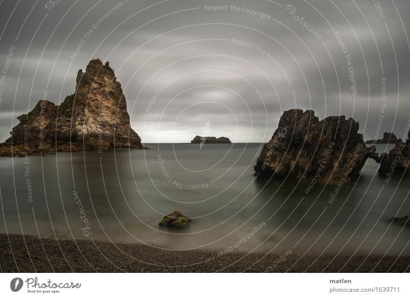 somber Nature Landscape Clouds Horizon Summer Weather Bad weather Rock Coast Beach Ocean Deserted Dark Sharp-edged Brown Gray Green White Bizarre Colour photo