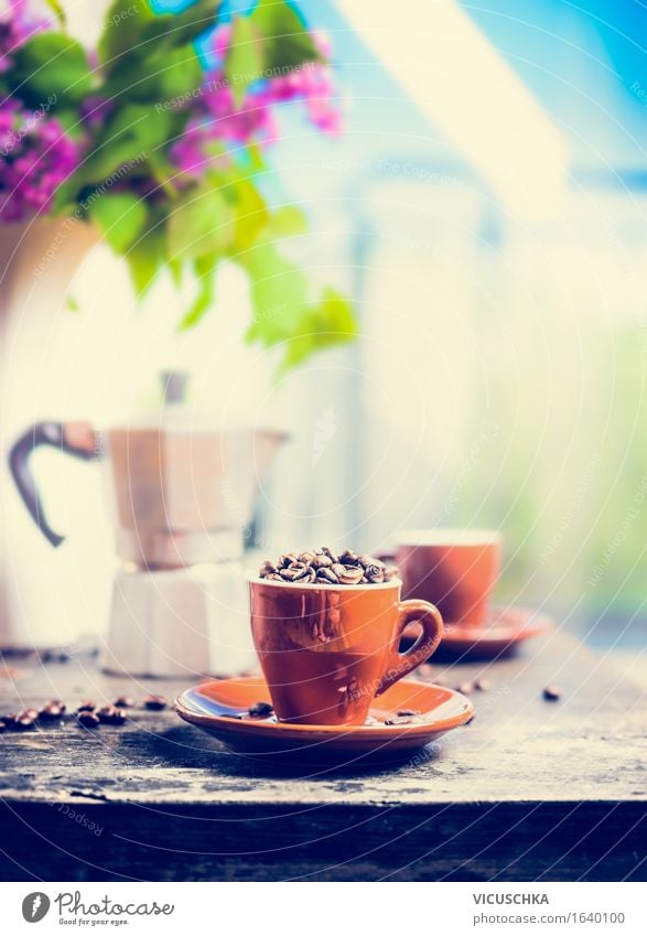 Espresso cup full of coffee beans on the kitchen table Food Breakfast Beverage Hot drink Coffee Cup Lifestyle Style Design Living or residing Garden Table