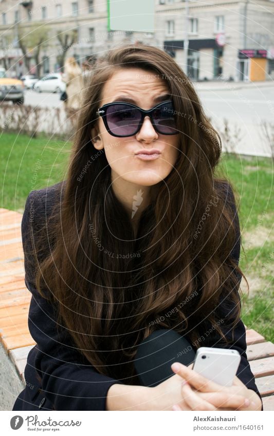 Business woman in a park making faces. Lifestyle Style Joy Beautiful Face Cellphone Young woman Youth (Young adults) 1 Human being 18 - 30 years Adults Summer