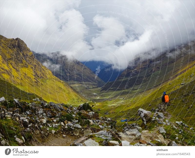 View of the misty valley, Salkantay-Trek, Peru Man Adults Environment Nature Landscape Elements Earth Air Sky Clouds Sunlight Weather Wind Fog Grass Rock