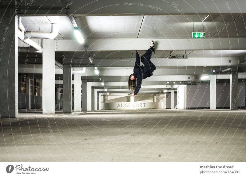 exit Colour photo Interior shot Night Artificial light Light Shadow Contrast Shallow depth of field Full-length Downward Looking away Lifestyle Climbing