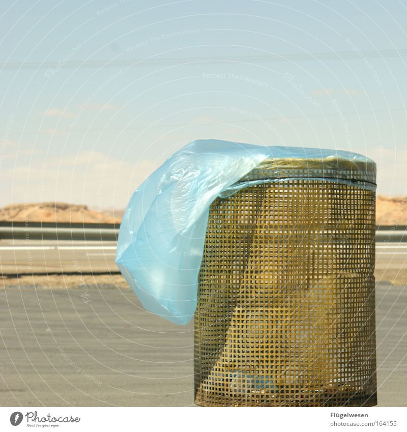 Wastepaper basket in the steppe longs for rubbish Colour photo Exterior shot Detail Deserted Copy Space top Day Sunlight Sunbeam Central perspective