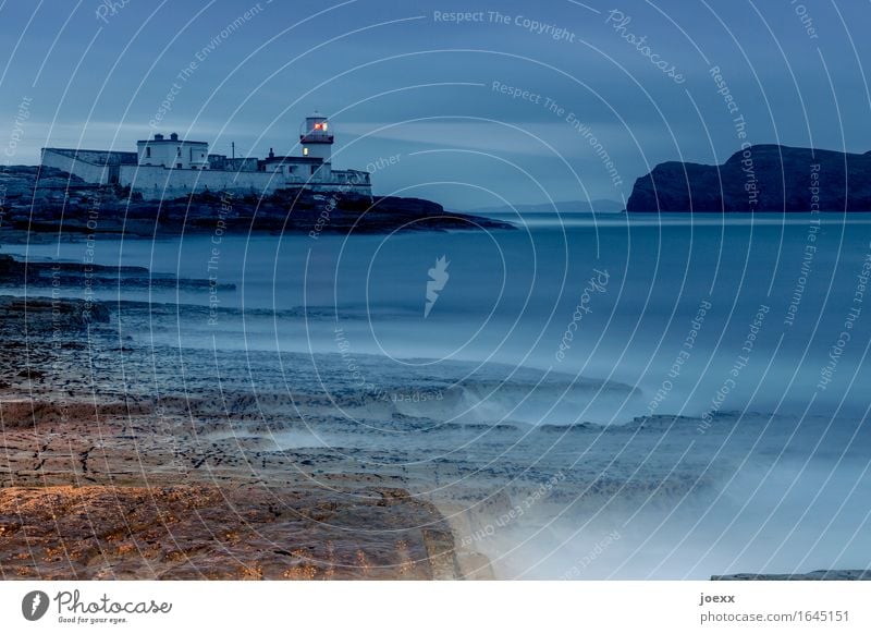 15° north Water Sky Rock Coast Ocean Valentia Iceland Ireland Lighthouse Illuminate Old Historic Blue Brown Red Loneliness Safety Colour photo Exterior shot