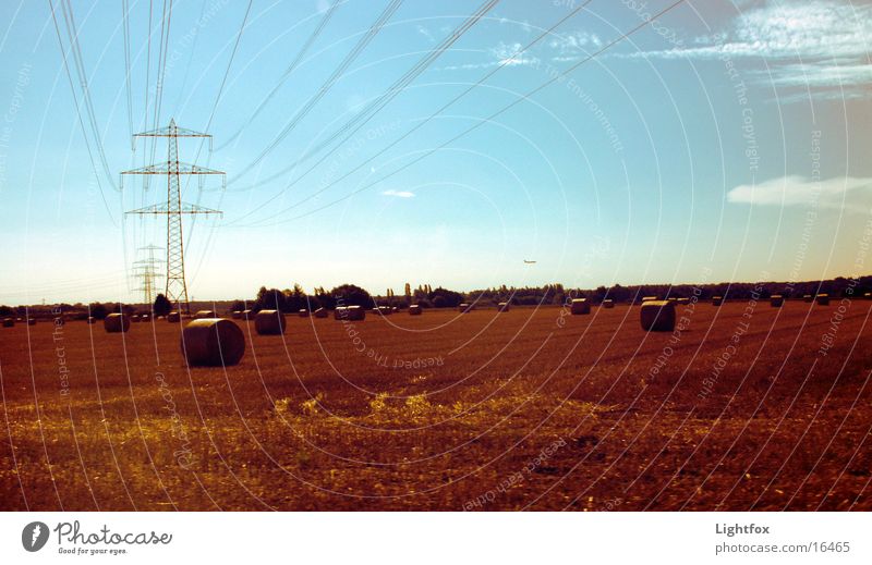 The field to me Field Bale of straw Airplane Agriculture Wheat Autumn Electricity pylon Combine Leisure and hobbies Sky Gold Harvest Nature