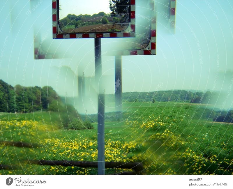 The world is a kaleidoscope Colour photo Exterior shot Close-up Experimental Reflection Road traffic Motoring Road sign Mirror Signage Warning sign