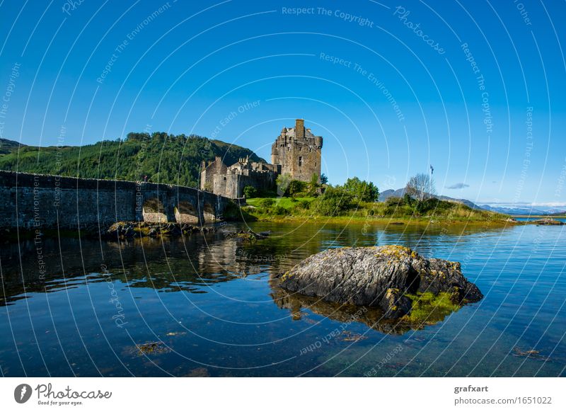 Eilean Donan Caste in Scotland Eilean Donan castle Castle Building Fortress Bridge Water Lake Hollow Rock Sky Old clan Past Great Britain Picturesque Landscape