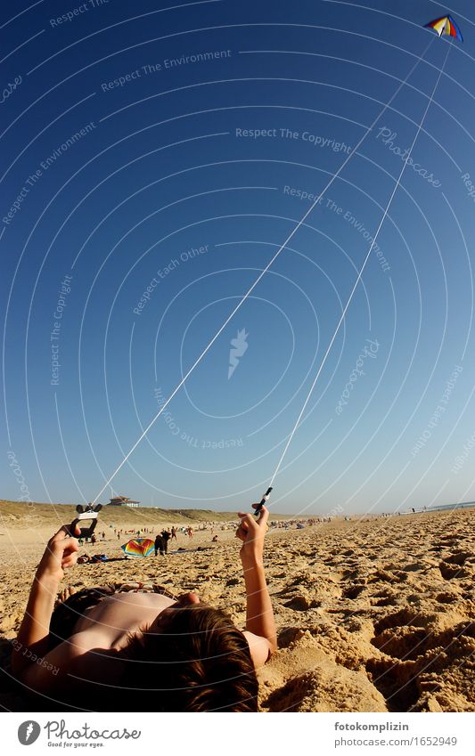 Kite flying on the beach - boy lying in the sand flying a kite Dragon kites Hang gliding deceleration Children's game Floating Easygoing Vacation & Travel