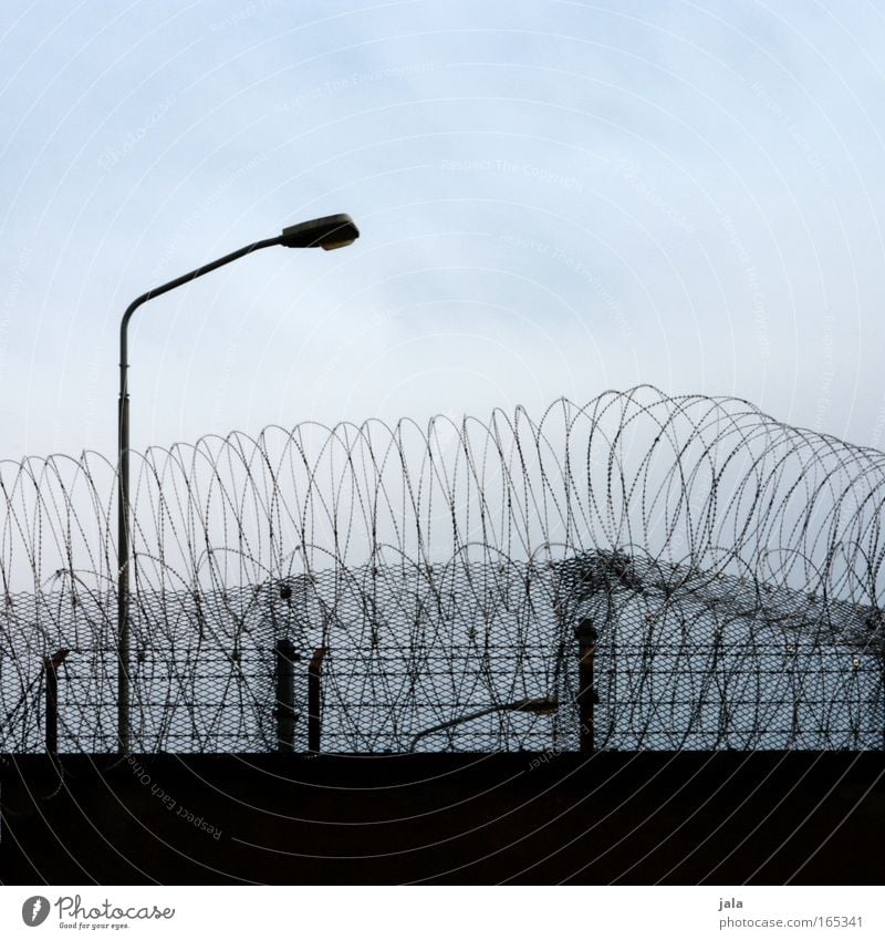 Swedish Overgardienen Subdued colour Exterior shot Deserted Day Shadow Contrast Building Wall (barrier) Wall (building) Fear Force Closed Barbed wire