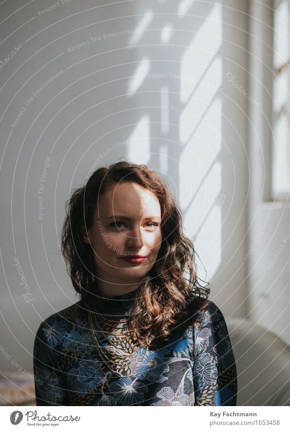 Portrait of a young woman with shadow on her face Lifestyle Living or residing Flat (apartment) Moving (to change residence) Human being Feminine Young woman