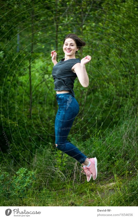 young woman jumps in the air outside in the nature Woman Young woman Jump that Nature jump of friends Youth (Young adults) Adults green Park Tall happy