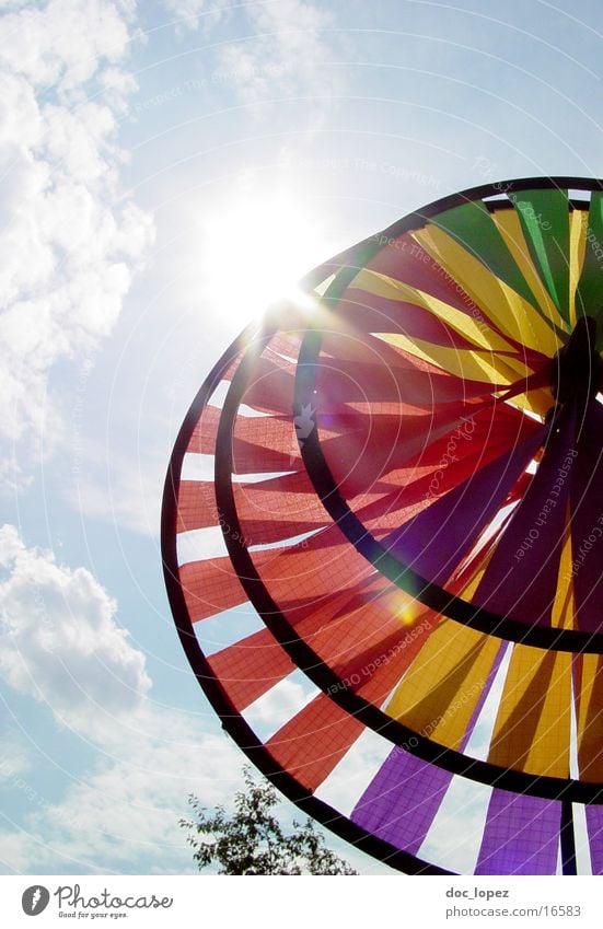 Wind Turbine View_1 Multicoloured Dazzle Clouds Toys Round Things Sky Sun Perspective Bright Partially visible Lens flare Pinwheel