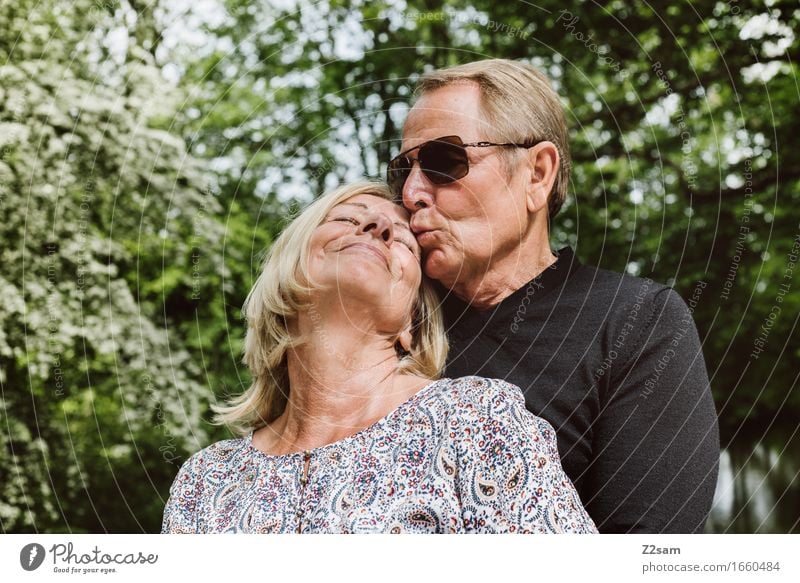 Retired couple Female senior Woman Male senior Man Couple Partner 60 years and older Senior citizen Nature Landscape Summer Beautiful weather To enjoy Kissing