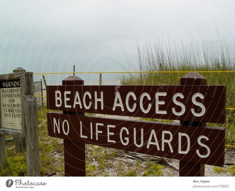 at your own risk Beach Bay watch Ocean Bad weather Leisure and hobbies Signs and labeling Beach dune Warning label Signage