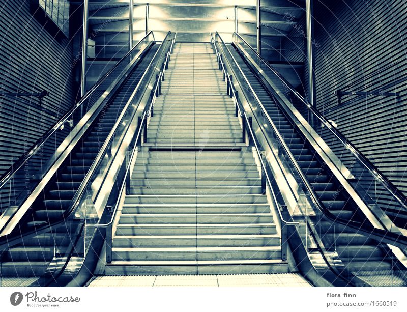 Opposite escalators Leipzig Saxony Germany Europe Small Town Deserted Train station Stairs Station hall Symmetry Logistics Escalator Light Colour photo