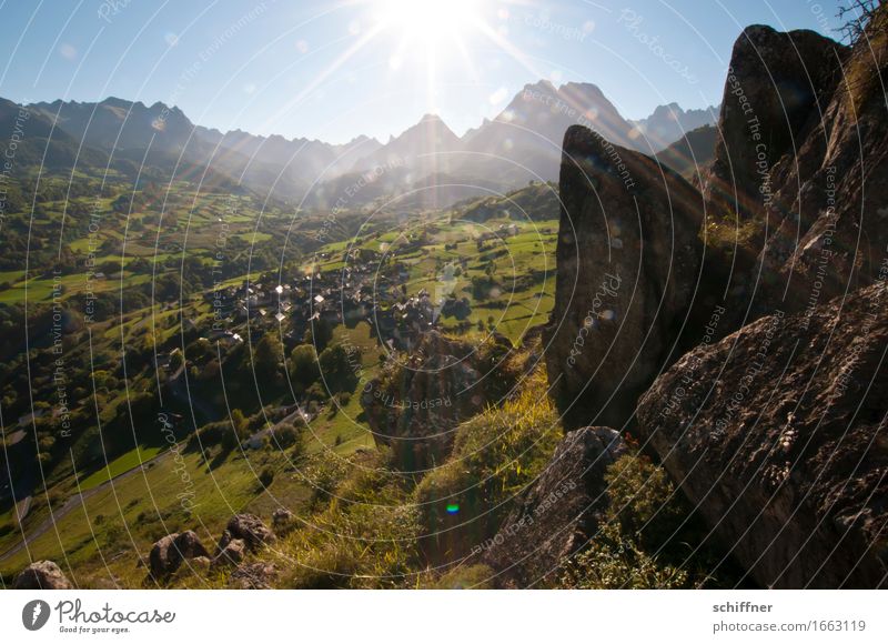 What a circus! Environment Nature Landscape Sky Cloudless sky Sun Sunlight Beautiful weather Meadow Forest Rock Mountain Peak Blue Green Mountain range Village