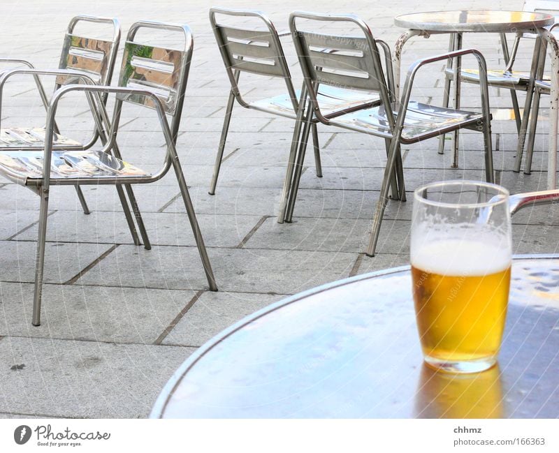 half empty or half full? Colour photo Subdued colour Exterior shot Close-up Day Beverage Drinking Cold drink Alcoholic drinks Beer Furniture Bar Cocktail bar