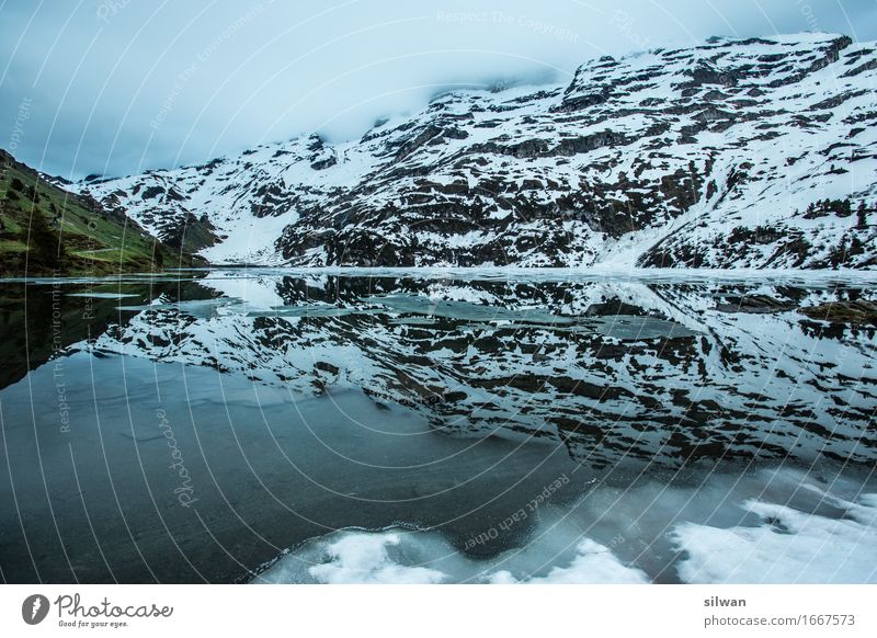 Engstlenalp mountain lake Hiking Nature Landscape Sky Clouds Spring Bad weather Fog Ice Frost Snow Alps Mountain Peak Snowcapped peak Lake Engstlenalp Lake