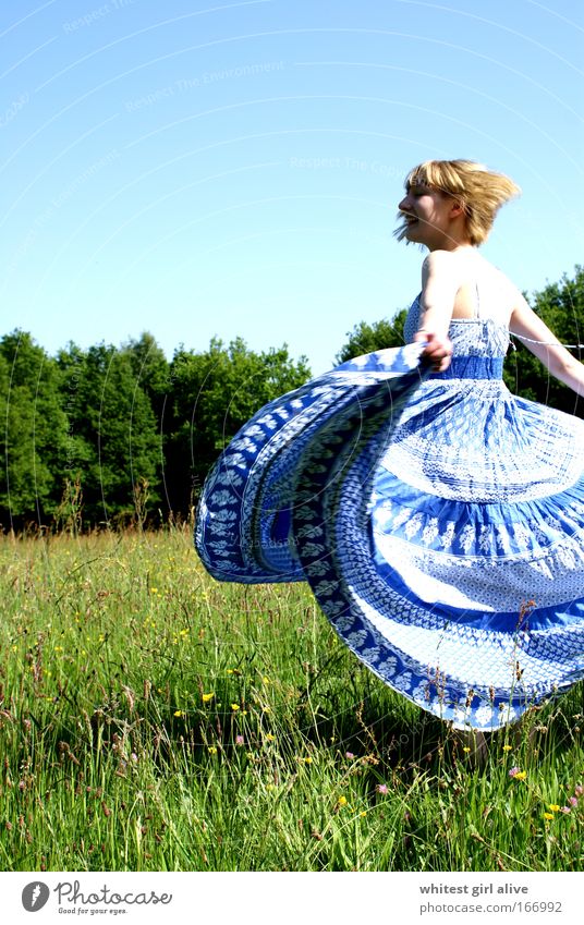 zestfully Colour photo Exterior shot Day Sunlight Rear view Half-profile Human being Young woman Youth (Young adults) 1 Movement Rotate Laughter Illuminate