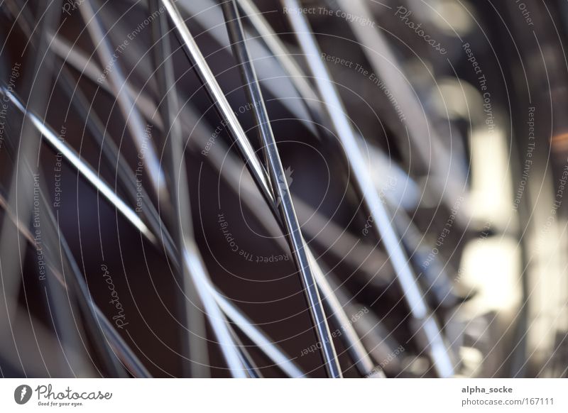 Motorcycle spokes Colour photo Exterior shot Close-up Detail Deserted Copy Space right Day Shadow Contrast Blur Shallow depth of field Worm's-eye view