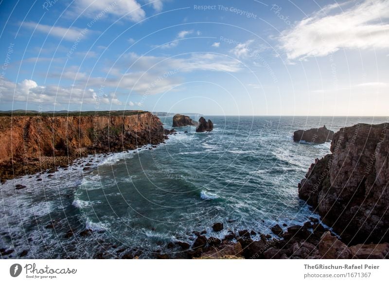 cliff Environment Nature Landscape Blue Brown Black Turquoise White Portugal Ocean Waves White crest Cliff Coast Rock Moody Clouds Colour photo Exterior shot