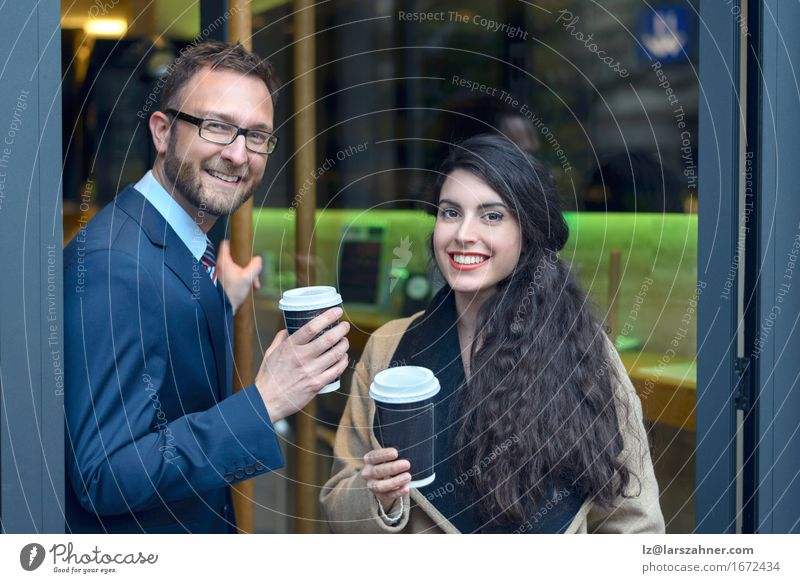 Two business colleagues purchasing coffee Coffee Happy Business Woman Adults Man Couple 2 Human being 18 - 30 years Youth (Young adults) 30 - 45 years Suit Tie