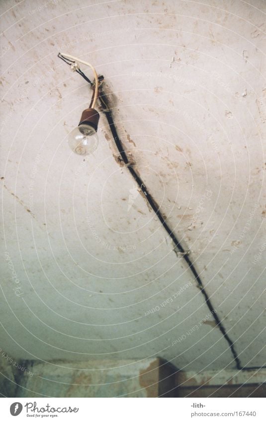 lamp Subdued colour Interior shot Deserted Day Worm's-eye view Electric bulb Energy industry Cable Bernburg Wall (barrier) Wall (building) Roof Old Dirty Simple