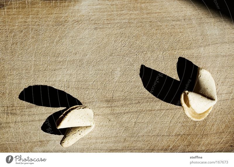 lucky devil Subdued colour Studio shot Close-up Copy Space top Neutral Background Shadow Fortune cookie Asian Food Chopping board Wooden board Success