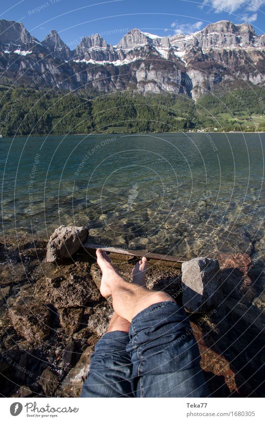 At the lake Human being Legs Feet 1 Environment Nature Landscape Alps Mountain Peak Lake Adventure Switzerland Walensee Colour photo Exterior shot