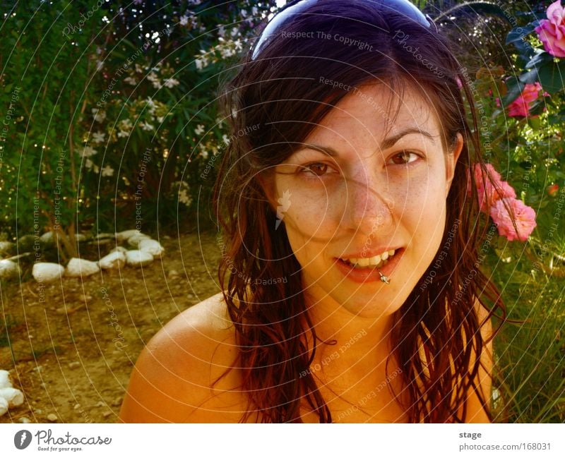 Female garden Colour photo Close-up Copy Space left Copy Space bottom Day Sunlight Portrait photograph Looking into the camera Happy Beautiful