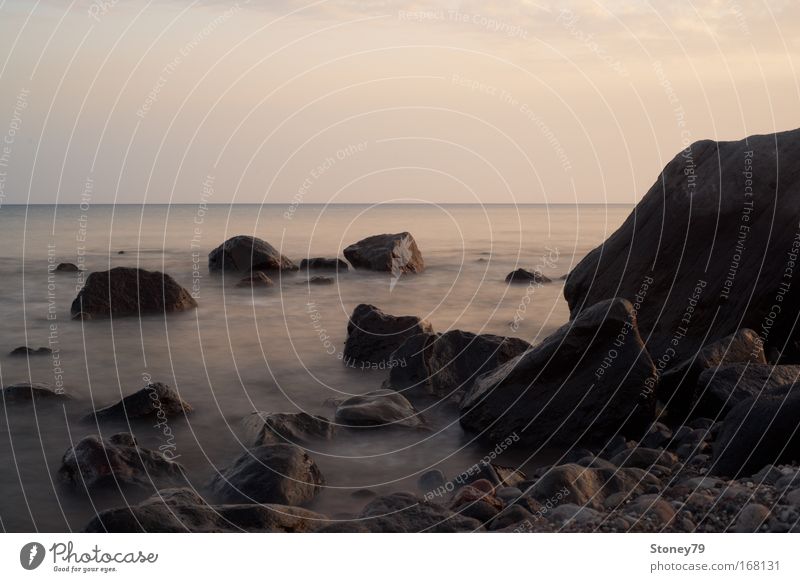 Rocks in the sea Colour photo Exterior shot Deserted Copy Space top Evening Contrast Sunlight Long exposure Deep depth of field Central perspective Ocean